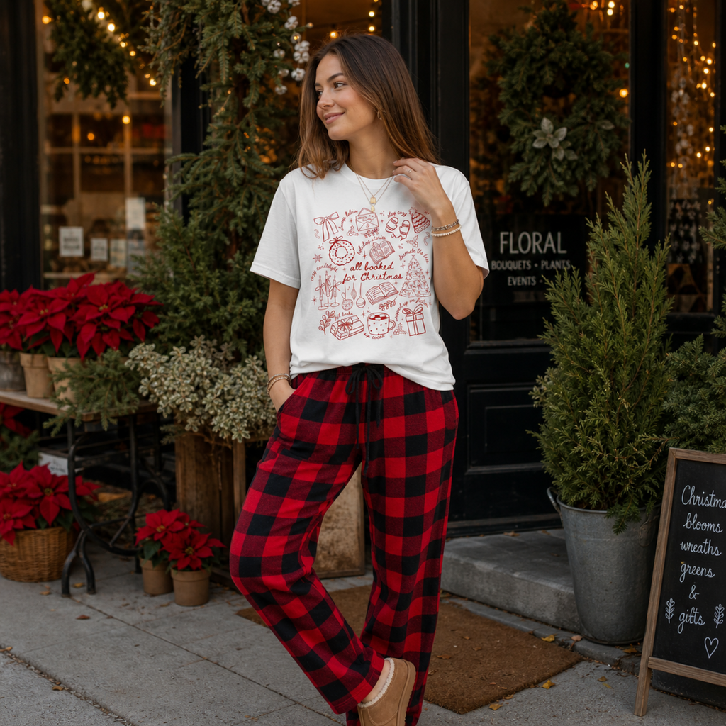 Woman wearing the All Booked for Christmas Comfort Colors 1717 holiday graphic tee with cozy festive outfit