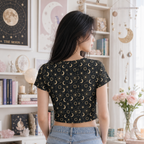 Women's celestial moon and sun all-over print crop tee back view featuring a mystical astrology pattern.
