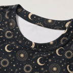 Close-up of the celestial moon and sun all-over print on a women's crop tee showing the detailed astrology design.