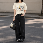 Woman wearing a Comfort Colors 1717 Purrfect Love cat graphic T-shirt with cute illustrated cats on the front.